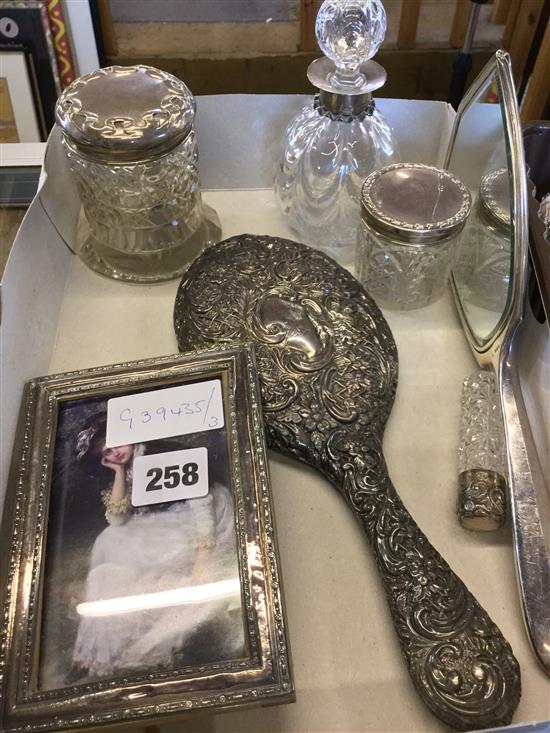 4 silver topped bottles, mirrors and a frame